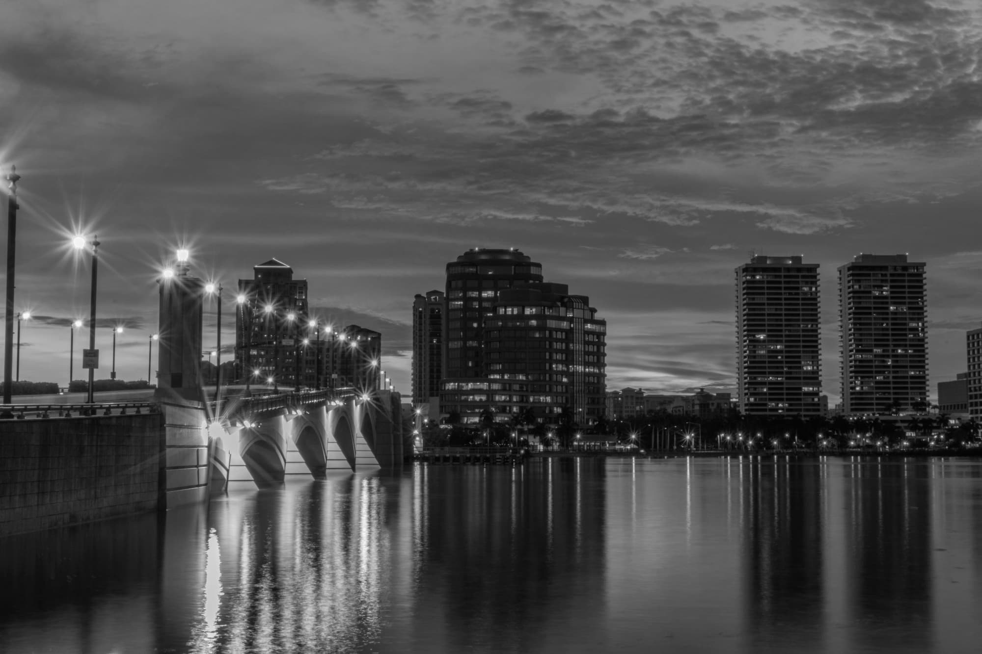 West Palm Beach skyline at dusk across Lake Worth Lagoon