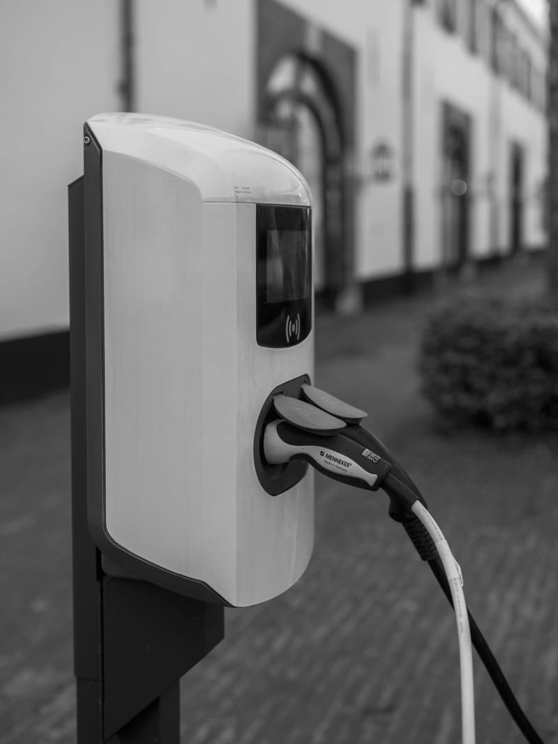 Electric vehicle plugged in at a charging station